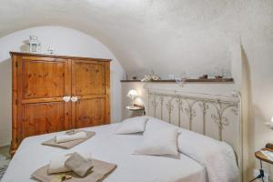 Postel nebo postele na pokoji v ubytování Agriturismo U' Spigu Nonna Annetta