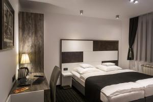 Posteľ alebo postele v izbe v ubytovaní Log In Rooms