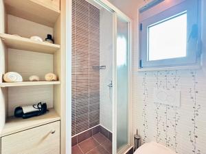 a bathroom with a shower with a glass door at Vila Jadranka Apartments in Herceg-Novi +67 photos
