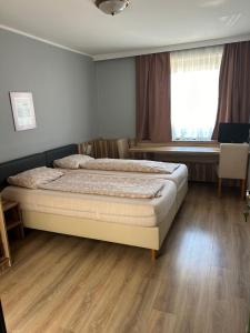 Postel nebo postele na pokoji v ubytování ''Am Limes'' Hotel