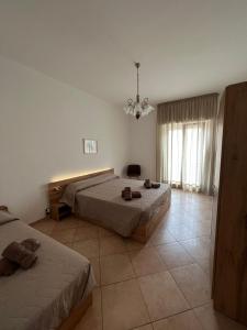 Ένα ή περισσότερα κρεβάτια σε δωμάτιο στο Cave House Castellana Grotte