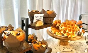 a display of bread and pastries on a table at Les Capucines Saint Tropez in Saint-Tropez