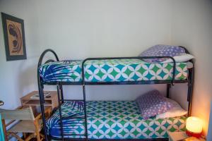 a bedroom with two bunk beds in a room at Sea Point in Celle Ligure