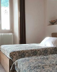 Postel nebo postele na pokoji v ubytování B&B La Corte del Segrino