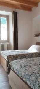 Postel nebo postele na pokoji v ubytování B&B La Corte del Segrino