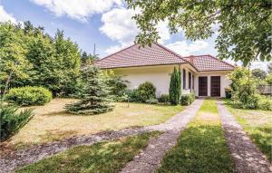 a house with a yard with a pathway at Lovely Home In Parzensko With Sauna in Karsko