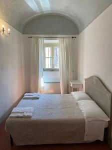Postel nebo postele na pokoji v ubytování BonConvento Guesthouse - HiTuscany