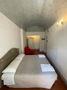 Postel nebo postele na pokoji v ubytování BonConvento Guesthouse - HiTuscany
