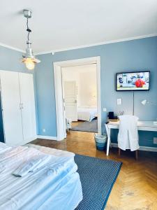 TV a/nebo společenská místnost v ubytování Wisby Residence + 37 fotografií