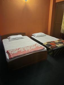 Postel nebo postele na pokoji v ubytování Danda Pari Homestay