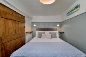 Postel nebo postele na pokoji v ubytování Finest Retreats - Duck Down Cottage