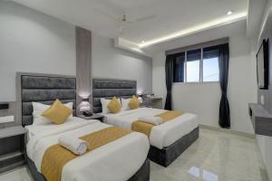 Postel nebo postele na pokoji v ubytování Hotel Isra International, BKC