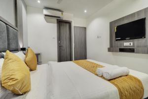 Postel nebo postele na pokoji v ubytování Hotel Isra International, BKC