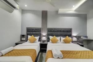 Postel nebo postele na pokoji v ubytování Hotel Isra International, BKC