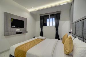 Postel nebo postele na pokoji v ubytování Hotel Isra International, BKC
