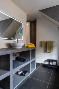 a bathroom with a sink and a mirror at 3 Kings in Bruges +39 photos