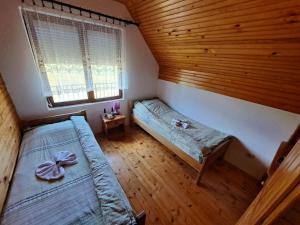 Postel nebo postele na pokoji v ubytování Eco Village Podgora Household Kaljevic