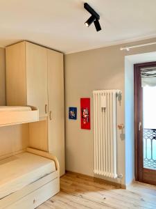 a room with a bunk bed and a radiator at Maison Lalla in Pré-Saint-Didier