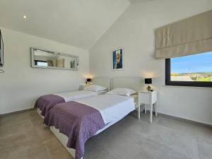 Posteľ alebo postele v izbe v ubytovaní Villa VI