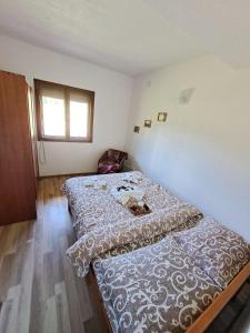Postel nebo postele na pokoji v ubytování Eco Village Podgora Household Kaljevic