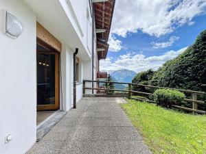 a door to a building with a view of a mountain at Plein Ciel 118 **** in Verbier
