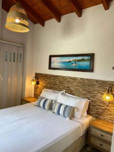 Ένα ή περισσότερα κρεβάτια σε δωμάτιο στο Lemon Tree Cottage - Agios Markos - Corfu