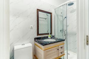 a bathroom with a sink and a shower at Costa Marbella Star Light in Marbella +69 photos