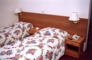 Postel nebo postele na pokoji v ubytování Hotel Capri