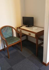 TV a/nebo společenská místnost v ubytování Hotel Capri