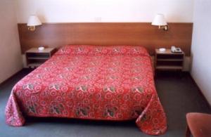 Postel nebo postele na pokoji v ubytování Hotel Capri