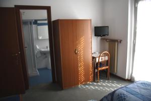 Postel nebo postele na pokoji v ubytování Hotel Capri