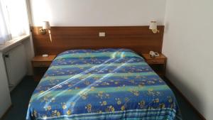 Postel nebo postele na pokoji v ubytování Hotel Capri