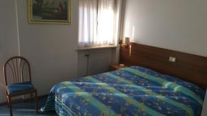 Postel nebo postele na pokoji v ubytování Hotel Capri