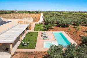 an aerial view of a villa with a swimming pool at Cavalè in Menfi