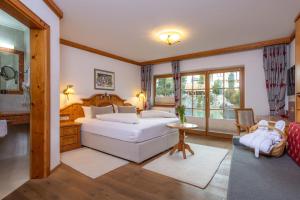 Ліжко або ліжка в номері Vitalhotel Sonnenhof +37 фото