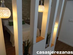 Postel nebo postele na pokoji v ubytování Casas jerezanas Loft Olivier