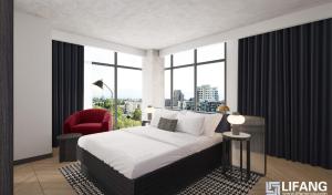 a bedroom with a large bed and a red chair at The Rose Gaming Resort in Dumfries