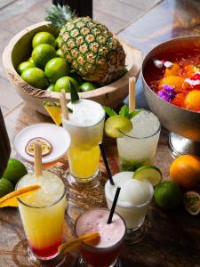 a group of drinks on a table with a bowl of fruit at The Nici in Bournemouth