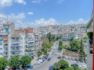 a view of a city with cars parked on a street at AYA Luxury Home - free public parking in Thessaloniki