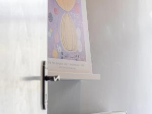 a picture of a banana hanging on a refrigerator at Pass the Keys West End Cosy Pop of Colour in Glasgow