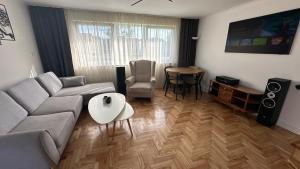 a living room with a couch and a table at Jodełka in Narol