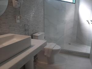 Um banheiro em Hotel 7 Colinas