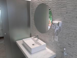 Um banheiro em Hotel 7 Colinas