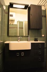 a bathroom with a sink and a mirror at antignano mare in Livorno