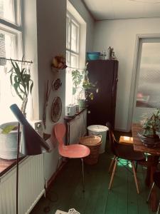 a room with a table and a chair and a desk at St'ngt in Borrby +14 photos