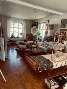 a living room with two beds and a couch at St'ngt in Borrby