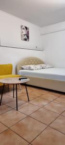 a room with a bed and a coffee table at Grika apartment in Split