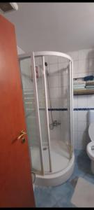 a glass shower in a bathroom with a toilet at Grika apartment in Split