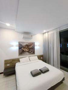 A bed or beds in a room at Smart Conzept 2bdr