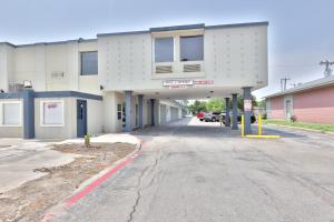 an empty parking lot in front of a building at Americas Best Value Inn San Antonio Airport South in San Antonio